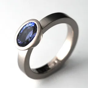 White gold ring with oval cut iolithe